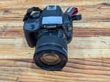 a camera that is sitting on a wooden table