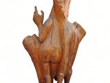 statue of a bird on a pedestal with a white background