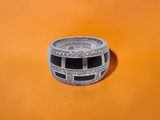 an image of a silver ring with black and white stones