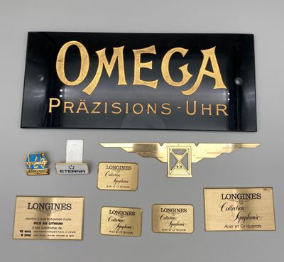 une pancarte sur laquelle est écrit « omega prasisons uhr »