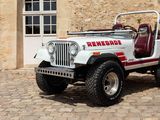 a white jeep parked in front of a stone building