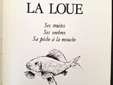 un livre ouvert dont la couverture est ornée d'un dessin représentant un poisson