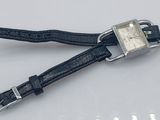 an image of a watch that is laying on a white surface