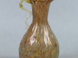 a glass vase that is sitting on a table