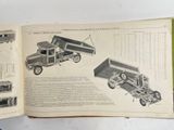 a book with a picture of a dump truck and a dump truck on it