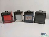 four boxes of different colors and sizes of items on a white surface