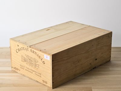 wooden crate on wooden table with white wall in background