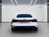 the rear end of a white audi car in a white room