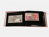 a black wallet with a picture of a dragon on it