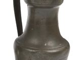 an old metal pitcher with a handle on a white background