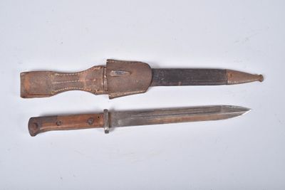 two knives that are sitting next to each other on a table
