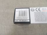 a label on the back of a cell phone that is sitting on a table
