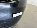 a close up of a car with a sticker on it ' s bumper