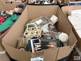 a cardboard box filled with assorted items in a store