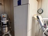 an image of a kitchen with a mixer and a refrigerator