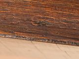 a close up of a wooden box on the floor
