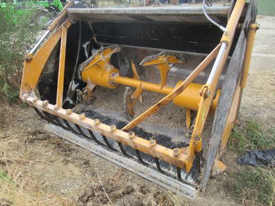 a yellow bulldozer that is sitting in the dirt