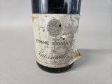 a bottle of wine that is sitting on a table