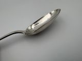 a spoon that is sitting on a table