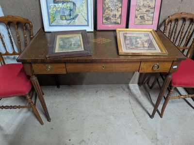 three chairs and a table with pictures on it