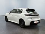 the rear end of a white toyota corollant parked in a room