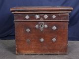 an old wooden box with metal studs on it