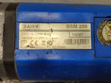 the back end of a blue machine with a label on it