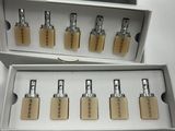 three boxes of various sizes and shapes of locks on a white surface