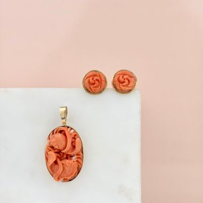 an image of a necklace and earring set on a marble surface