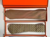 three ties in a box with a tie in the middle