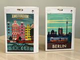 two boxes that have a picture of a city on them