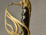 an image of a gold and black sword with a lion on it