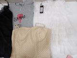 a box full of clothes and a bag on a table