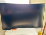 a large flat screen tv sitting on top of a trash can