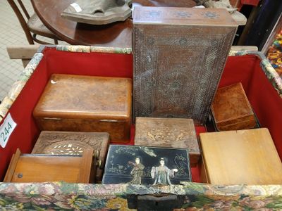 a trunk full of antique items on display in a store