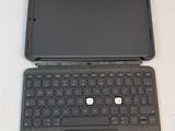 a black laptop with a black keyboard on a white table