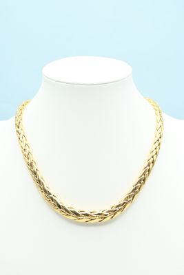 a gold necklace on a mannequin mannequin mannequin mannequin mannequin mann