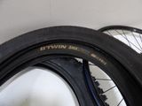 two tires that are on the wall next to each other