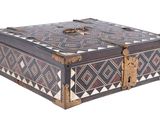 a wooden box with a decorative design on it