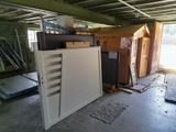 an image of a garage with a lot of furniture in it