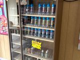a refrigerated display case with drinks in it