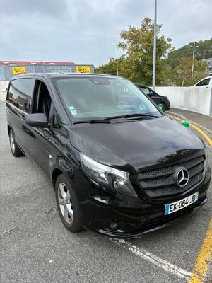 a black van parked on the side of the road