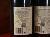 two bottles of wine that are on a table
