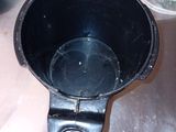 an image of a black cup sitting on a table