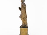 an image of a statue of a woman holding a bird on a pedestal
