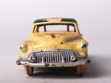 a yellow toy car that is sitting on a table