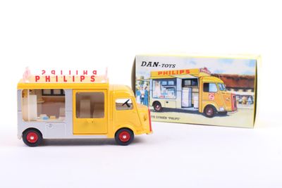 a yellow toy bus that is next to a box of ice cream