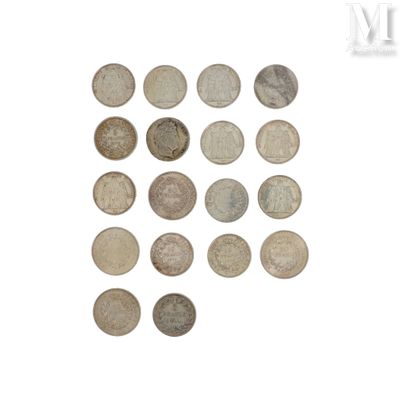 a lot of coins that are on a white surface