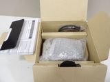 a cardboard box with a pair of scissors inside of it