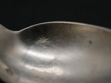 a spoon that is sitting on top of a table